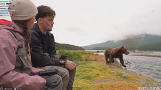 Streamers tunned as huge brown bear hunts right in front of them in Alaska