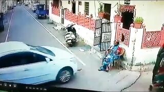 Woman sitting on Chair is Pushed through Concrete Wall