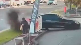 Insane Moment Out-Of-Control Car Narrowly Misses Pedestrian Before Petrol Station Crash
