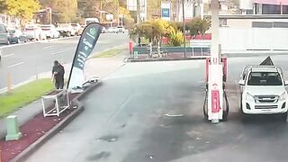 Insane Moment Out-Of-Control Car Narrowly Misses Pedestrian Before Petrol Station Crash