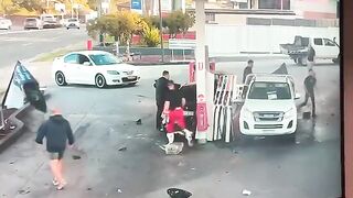 Insane Moment Out-Of-Control Car Narrowly Misses Pedestrian Before Petrol Station Crash