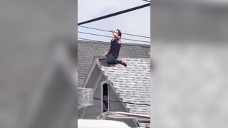 Man who wont get off the roof is bribed by police with what appear to be Twisted Teas