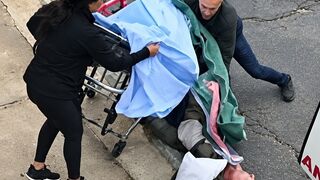 A frail patient fell from stretcher while being transported from home to an ambulance