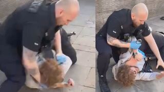 Police in Manchester just used handcuffs like a knuckle duster on a man already on the floor.