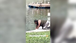 Woman in MacArthur Park chugs filthy fountain water and douses herself with it. This