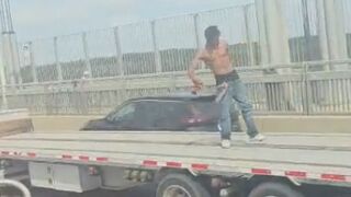 NYC daredevil dances, jumps on flatbed truck as it speeds across Washington Bridge