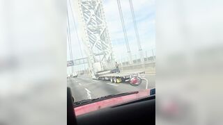 NYC daredevil dances, jumps on flatbed truck as it speeds across Washington Bridge
