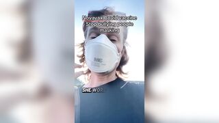 Masked liberal woman brags about getting her latest Covid vaccine in 2026.