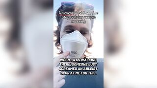 Masked liberal woman brags about getting her latest Covid vaccine in 2026.