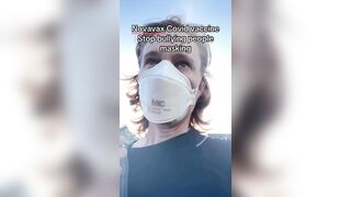 Masked liberal woman brags about getting her latest Covid vaccine in 2026.