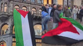 A huge Palestinian flag was unfurled from a building above an H&M store in Amsterdam during a pro-Israel demonstration