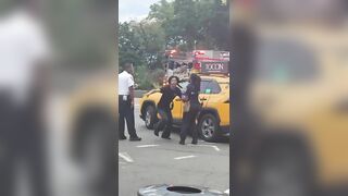Obese officer falls on stomach chasing a drugged-up criminal who jumps off a taxi
