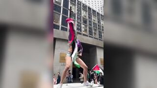 Transgender man stands on top of an NYPD car and screams “Free Palestine”