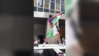 Transgender man stands on top of an NYPD car and screams “Free Palestine”