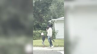 A father was filmed walking his little daughter to school... …armed with a AK-47