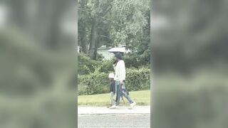 A father was filmed walking his little daughter to school... …armed with a AK-47