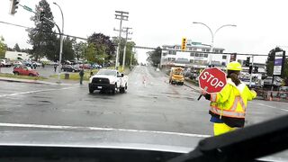 A traffic director walks into a vehicle and acts like she got hit