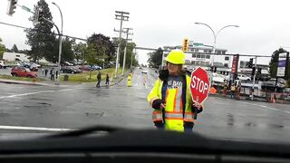 A traffic director walks into a vehicle and acts like she got hit