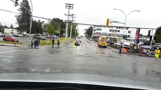 A traffic director walks into a vehicle and acts like she got hit