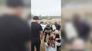 Good Samaritans help a woman out of her overturned car