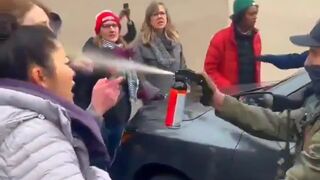 St. Paul Minnesota Masked federal agent pepper-spray protesters directly in the face