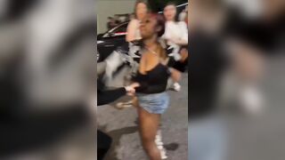 group of Black women BRUTALLY beating a White woman in the middle of the street.