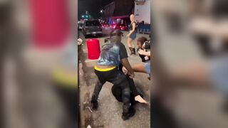 group of Black women BRUTALLY beating a White woman in the middle of the street.