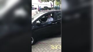 He spits on the Trump flag, speeds off, plows into a pole, cops show up.