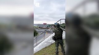 NOT AI-Russian soldier shoots down Ukrainian drone flying over a busy Moscow highway