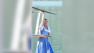 Olympian Alina Kornelli practicing on a pumpfoil in a traditional Bavarian dirndl