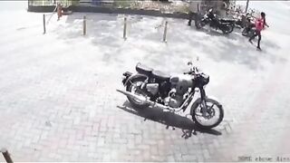 The Girl in the Pink is the One the Bull Wants. Boyfriend Stops his Bike Why?