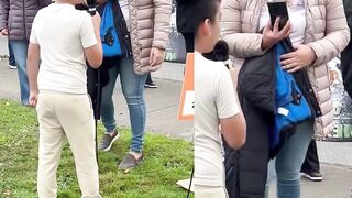 Smiling Latina mother films her son at an anti-ICE protest as he chants “Fuck ICE "
