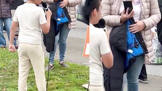 Smiling Latina mother films her son at an anti-ICE protest as he chants “Fuck ICE "