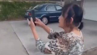 Woman Seen allegedly applying dog feces to wall to deter people from climbing over