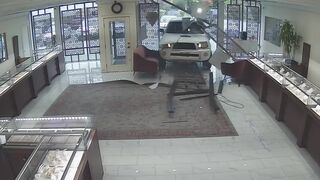 Washington jewelry store owner opens fire after would-be thieves ram truck through storefront