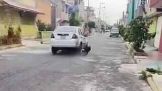 Man runs over Woman, drags her for several Meters and then Flees