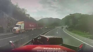 Woman in Red Pick-up makes Mistake with Big Rig on the Highway