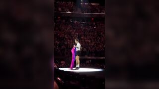 Harry Styles holds a Bisexual Pride flag on stage to announce a fans ‘coming out’