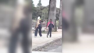 Asians stealing a giant carp from a pond in Sydney's Centennial Park