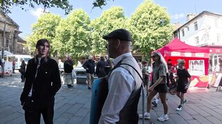Transgender lunatic threatens man holding a sign that reads “Trans women are men.”