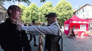 Transgender lunatic threatens man holding a sign that reads “Trans women are men.”