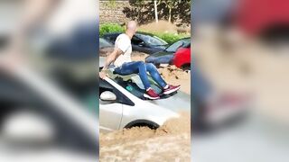 Flooding in Ecuador is so Bad, People have to Ride on Top of their Cars