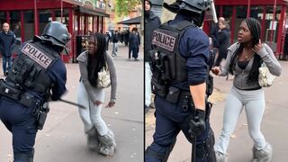 French police struck a woman who appears to have not done anything amid protests