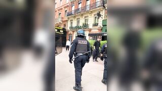 French police struck a woman who appears to have not done anything amid protests