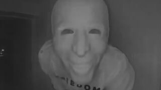 Person in Joe Biden mask and Charlie Kirk shirt eats banana on Texas family's doorbell cam