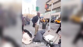Bystander starts choking pitbill after the dog bit a toddler and refused to let go in NYC