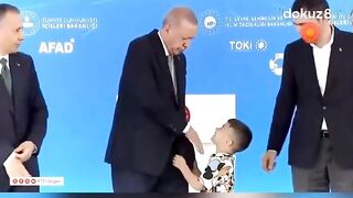 Turkish President Erdogan slaps a "little child" for not kissing his hand