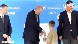 Turkish President Erdogan slaps a "little child" for not kissing his hand