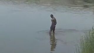 Illegal naked migrant make shit to the lake