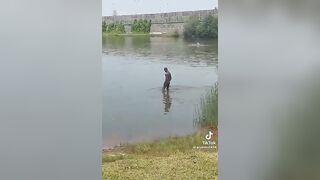 Illegal naked migrant make shit to the lake